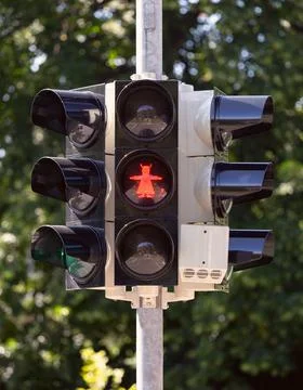 An image of a devil with horns and a tail at a traffic light in Wernigerode. Stock Photos