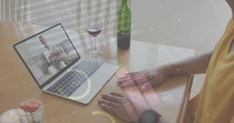 Image of diagrams and data processing over biracial man having image call with Foto stock