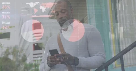 Image of diagrams and data processing over african american man using smartphone Foto stock