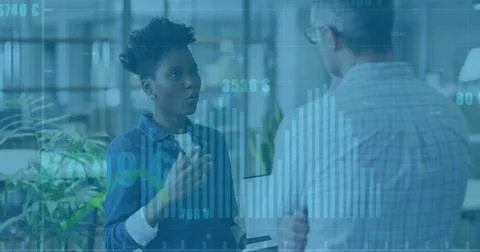 Image of diagrams and data processing over diverse colleagues talking in office Stock Photos