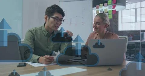 Image of digital cloud icons over diverse business people in office Stock Photos
