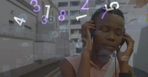 Image of digital data processing over african american woman using headphones Foto stock