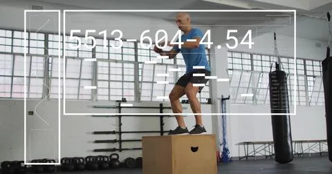 Image of digital data processing over biracial man exercising in gym, jumping on Stock Photos