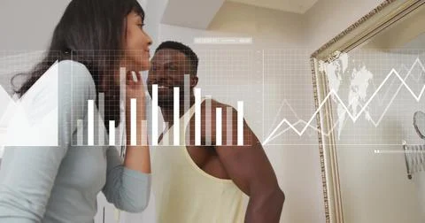 Image of digital data processing over diverse couple looking in mirror Stock Photos