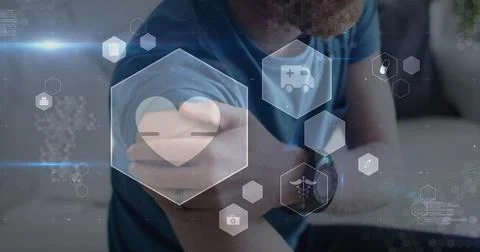Image of digital icons data processing over caucasian man rubbing arm Stock Photos