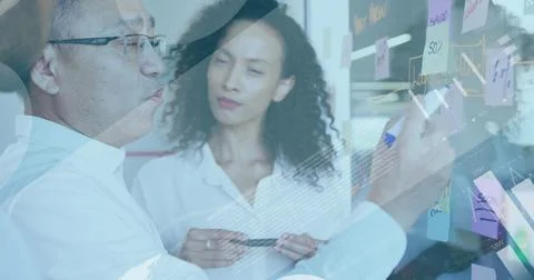 Image of digital infographic interface over multiracial coworkers discussing and Stock Photos