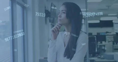 Image of digital interface showing floating numbers and a woman looking through Foto stock