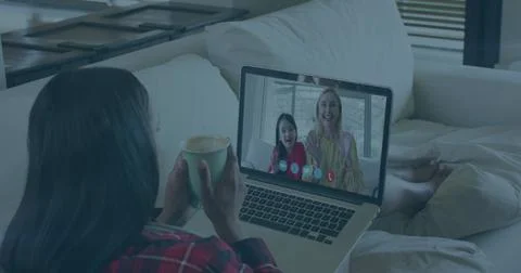 Image of digital shield and padlock over biracial woman having image call on Stockfoto's
