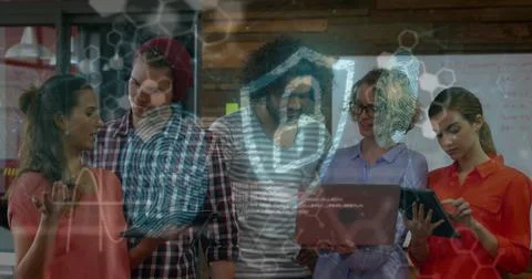 Image of digital shield with padlock over happy diverse female and male Stockfoto's