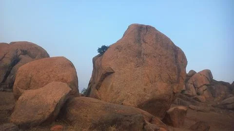 The image displays the distinctive boulder landscape found in Hampi, India.  Stock Photos