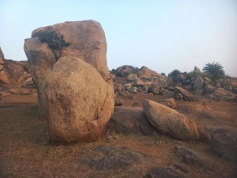 The image displays the distinctive boulder landscape found in Hampi, India.  Stock Photos