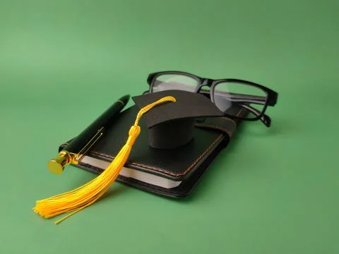 The image displays objects symbolizing academic achievement and education Stock Photos