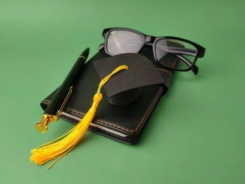 The image displays objects symbolizing academic achievement and education Stock Photos