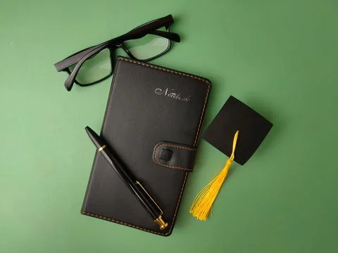 The image displays objects symbolizing academic achievement and education Stock Photos