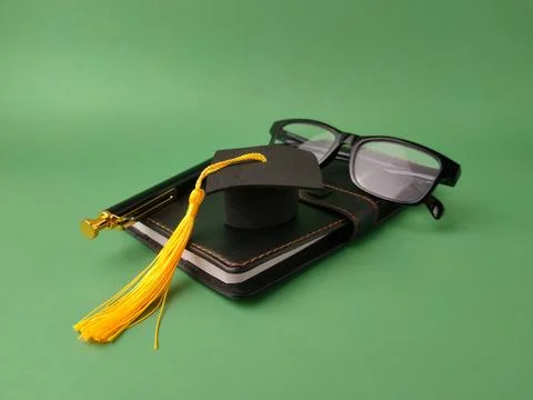 The image displays objects symbolizing academic achievement and education Stock Photos