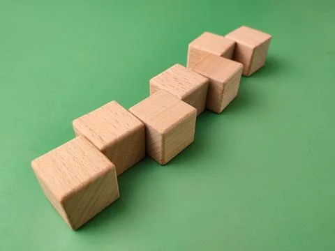 The image displays a set of eight small, smooth, unfinishedwooden cubesarra.. Stock Photos