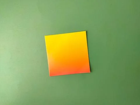 The image displays a square piece of paper with a yellow-to-orange gradient.. Stock Photos