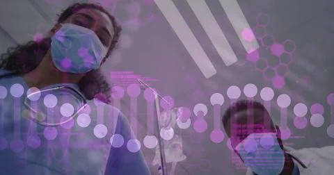Image of dna strand and data processing over diverse doctors with face masks 写真素材