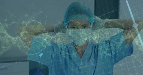 Image of dna strand and data processing over female caucasian surgeon with face Foto stock