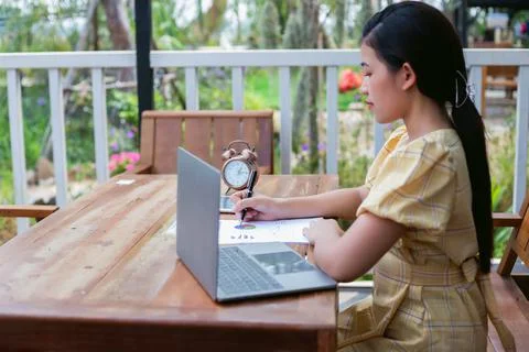 Image of document with charts on background of male and female working , busi Foto stock