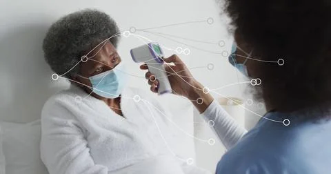 Image of dots forming abstract pattern over female nurse checking temperatu.. Foto stock