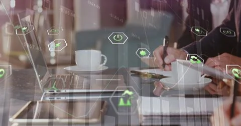 Image of eco icons and data processing over diverse business people in office Stock Photos
