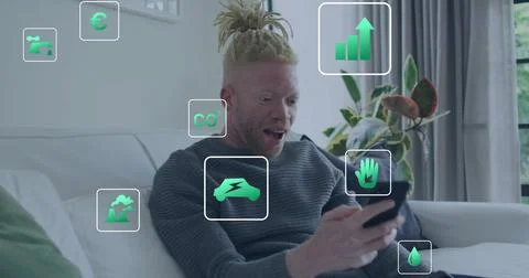 Image of eco icons and data processing over albino african american man using Foto stock