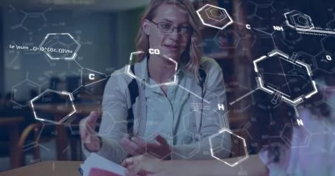 Image of elements and data processing over happy diverse female students talking Fotos Stock