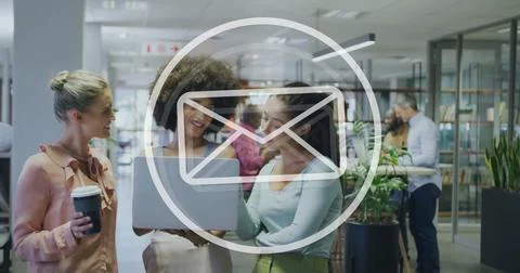 Image of email icon and data processing over diverse business people in office 写真素材