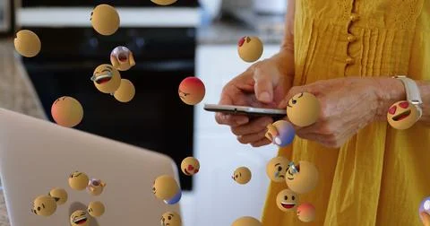 Image of emoticons floating over hands of caucasian woman using smartphone Stock Illustration