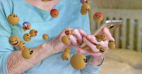 Image of emoticons floating over hands of caucasian senior woman using Stock Illustration