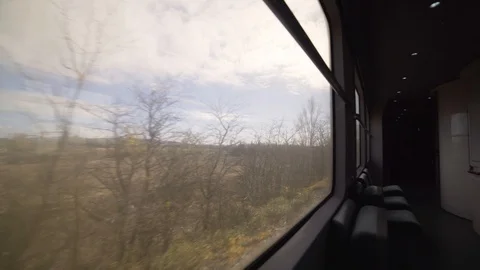 Image of empty passenger train wagon crossing the countryside, Italy. Stock Footage