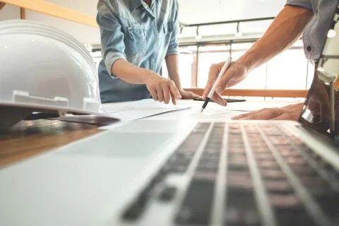 Image of engineer or architectural project, two engineering discussing and wo Stock Photos