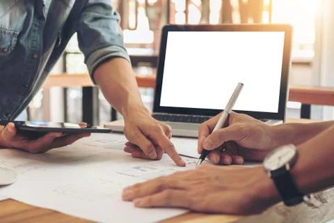 Image of engineer or architectural project, two engineering discussing and wo Stock Photos