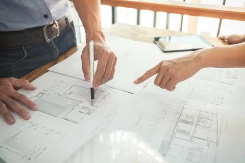 Image of engineer or architectural project, two engineering discussing and wo Stock Photos