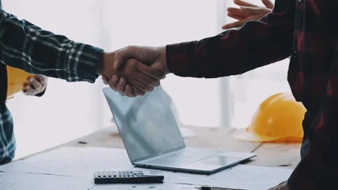 Image of engineering objects on workplace with three partners interacting o.. Stock Footage 239971129
