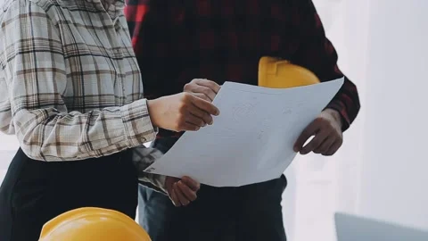 Image of engineering objects on workplace with three partners interacting o.. Stock Footage 239971150