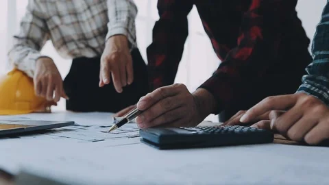 Image of engineering objects on workplace with three partners interacting o.. Stock Footage 239971173