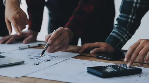 Image of engineering objects on workplace with three partners interacting o.. Stock Footage 239971175