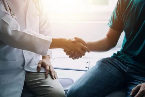Image of engineering objects on workplace with three partners interacting o.. Foto stock