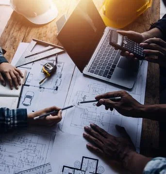 Image of engineering objects on workplace with three partners interacting o.. Stock Photos