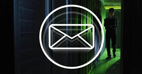 Image of envelope email icon over male technician with laptop in dark computer Foto stock