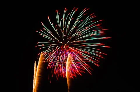 An image of exploding fireworks at night Stock Photos