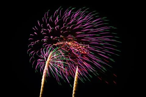 An image of exploding fireworks at night Stock Photos