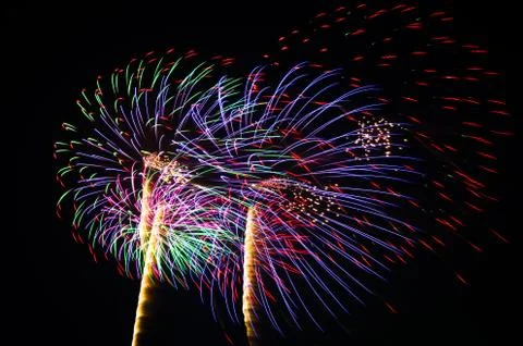An image of exploding fireworks at night Stock Photos