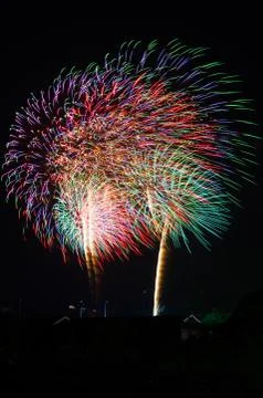 An image of exploding fireworks at night Stock Photos