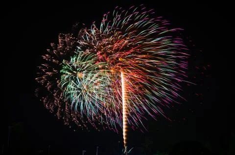 An image of exploding fireworks at night Stock Photos