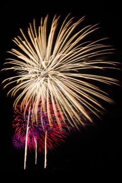 An image of exploding fireworks at night Stock Photos