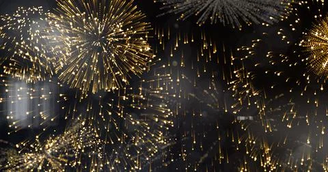 Image of exploding gold fireworks scrolling on black background イラスト素材