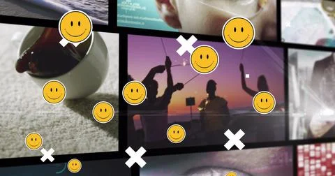 Image of falling emoji over screens on black background 스톡 일러스트
